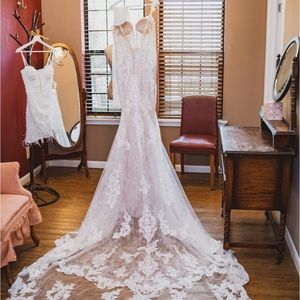 Beautiful designer wedding dress worn only for a few hours looks like new!